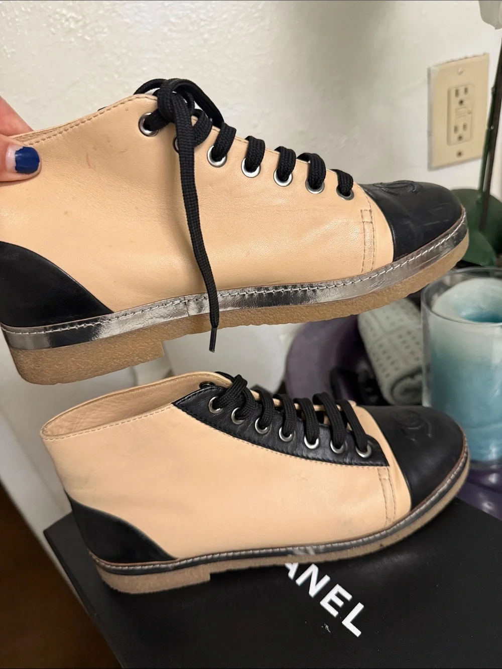 CHANEL Two-Tone Leather High-Top Sneakers in Beige & Black